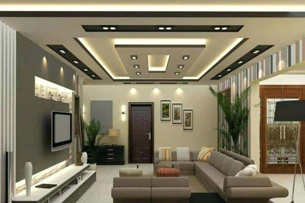 The living room boasts an eye-catching on false ceiling